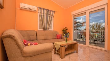 Apartment, 2 Bedrooms | Living area | Flat-screen TV