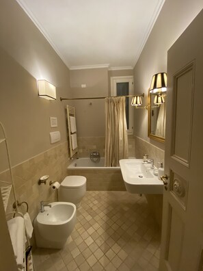Bathtub, hair dryer, towels, soap