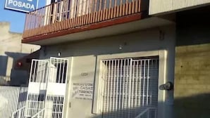 A two-story building with a balcony on the upper floor. - Posada Reforma (Oaxaca)