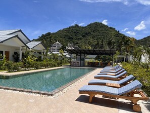 Outdoor pool, pool umbrellas, pool loungers