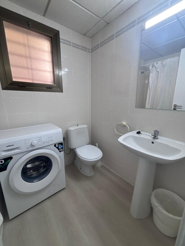 Bathtub, hair dryer, towels