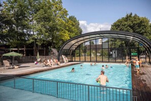 Indoor pool, seasonal outdoor pool, pool umbrellas, pool loungers