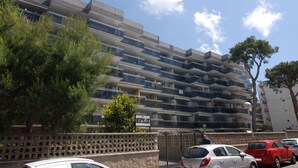 A multi-story residential building with balconies, a gated entrance, and a sign indicating the name "MONTELANG." - Montblanc Basic Zeus Salou 01521 (Salou)