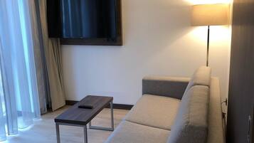 Suite, Non Smoking | Living room | 49-inch flat-screen TV with digital channels, TV
