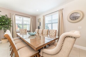 Enjoy meals in this stylish dining area with a glass-top table and comfortable seating for six.