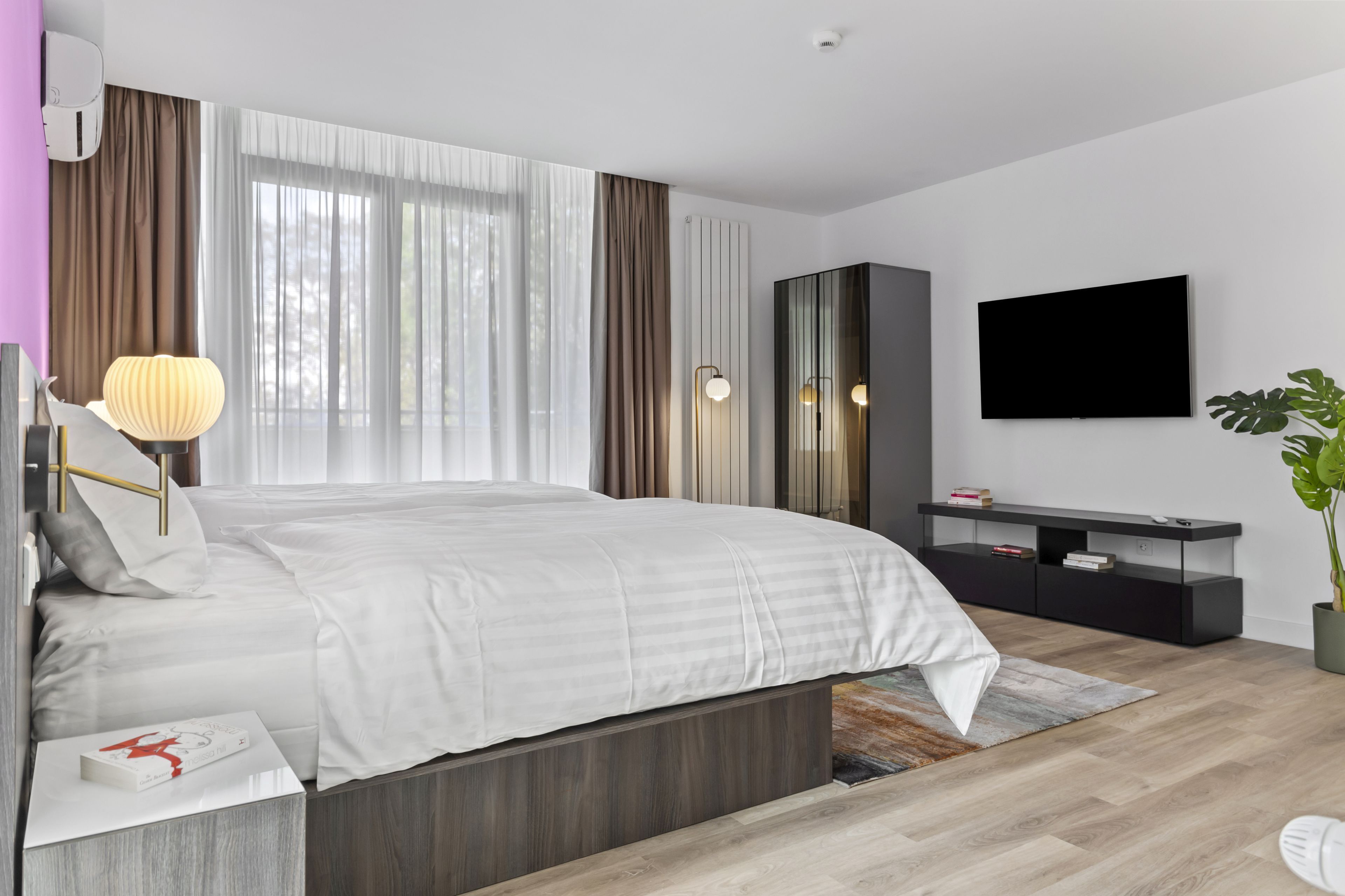 Premium bedding, down comforters, pillowtop beds, in-room safe