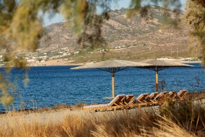 On the beach, sun-loungers, beach towels