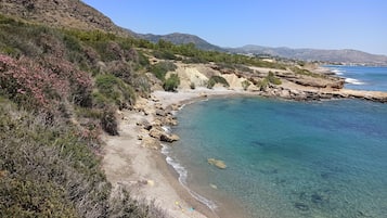 On the beach, sun loungers, beach towels