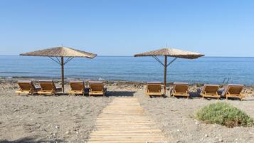 On the beach, sun loungers, beach towels
