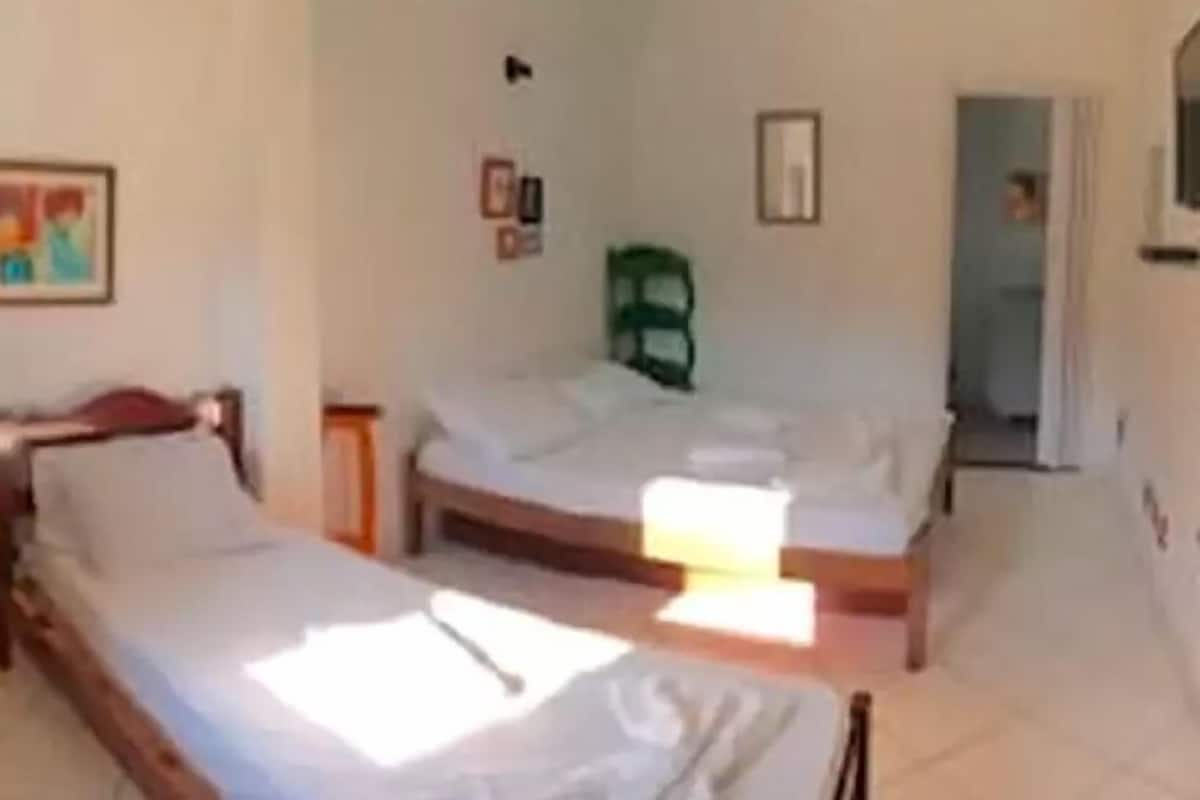 Triple Room, Multiple Beds | Minibar, desk, free WiFi, bed sheets