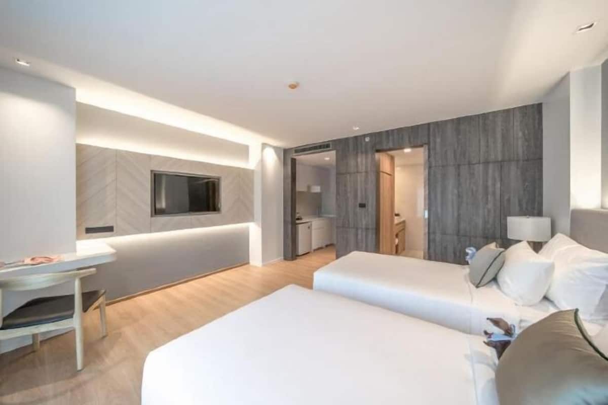 Luxe beddengoed, pillowtop-bedden, een minibar met enkele gratis items