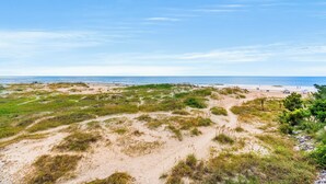 A coastal landscape with sand dunes, beach, and ocean. - Inlet Pointe Villas 14E-Oceanfront 2BR- Pool (North Myrtle Beach)