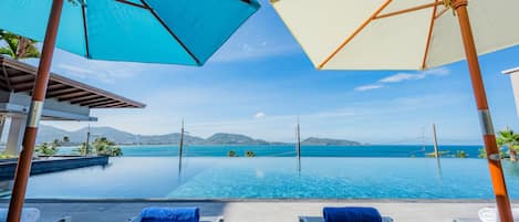 2 outdoor pools, pool umbrellas, pool loungers