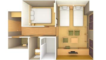 A modern hotel room with a bunk bed, a separate bathroom, and a desk area.