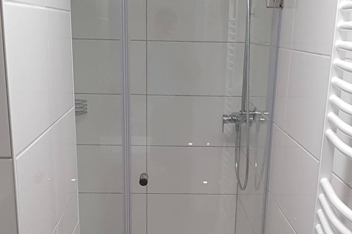 family room | bathroom | shower, slippers, towels