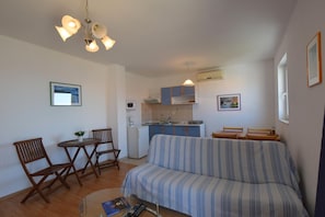 Apartment, 2 Bedrooms | Living area | TV