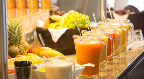 A juice bar with various fruits and beverages.