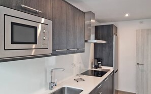 Fridge, microwave, stovetop, coffee/tea maker