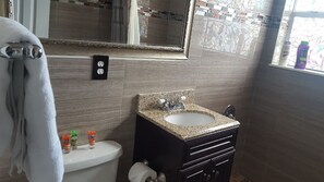 Shower, hair dryer, towels, soap