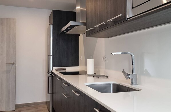 Fridge, microwave, stovetop, coffee/tea maker