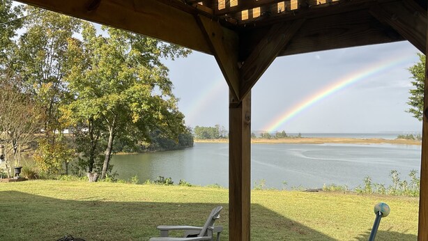 A gazebo with a view of a lake and a rainbow. - Water Views from most rooms-on the Rappahannock River (Locust Hill)