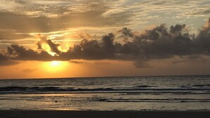 A sunset over the ocean with clouds in the sky. - Family Paradise- 2bdrm/2 bath condo, indoor pool, spa, outdoor pools, & tennis. (Hilton Head Island)