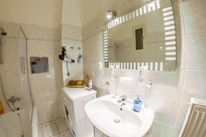 Combined shower/bathtub, hair dryer, towels, soap