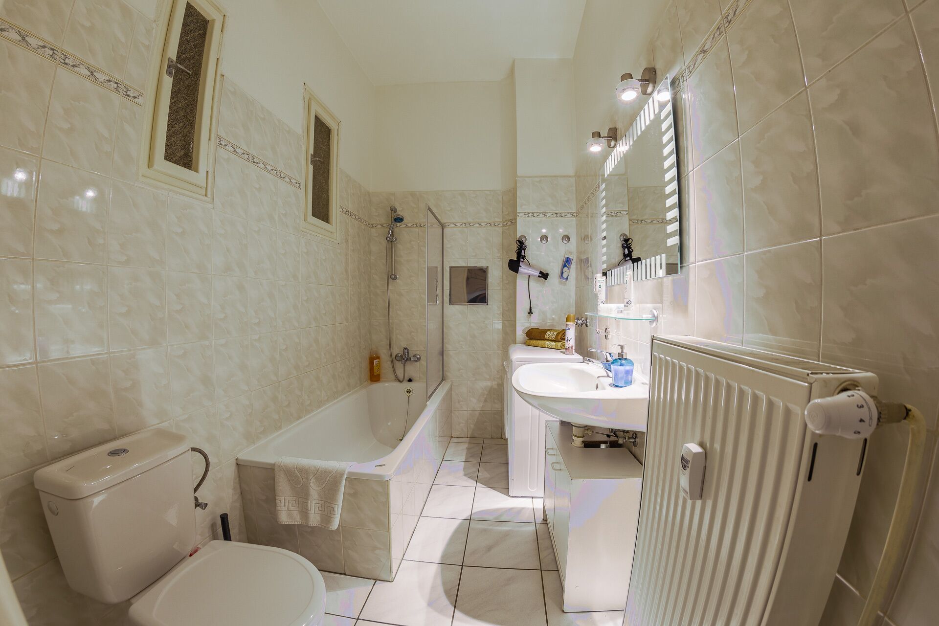 Combined shower/tub, hair dryer, towels, soap