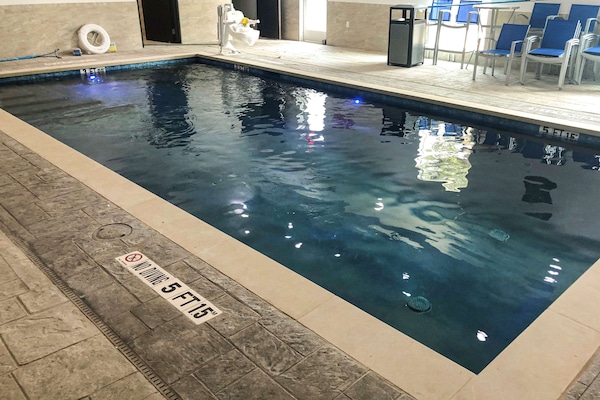 Indoor pool, open 10:00 AM to 10:00 PM, pool loungers
