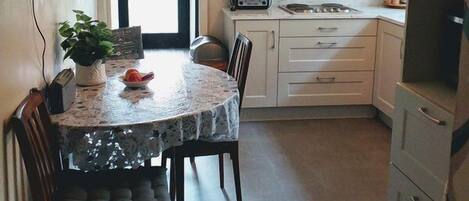 Two Bedroom Townhouse | Private kitchen | Fridge, microwave, oven, stovetop