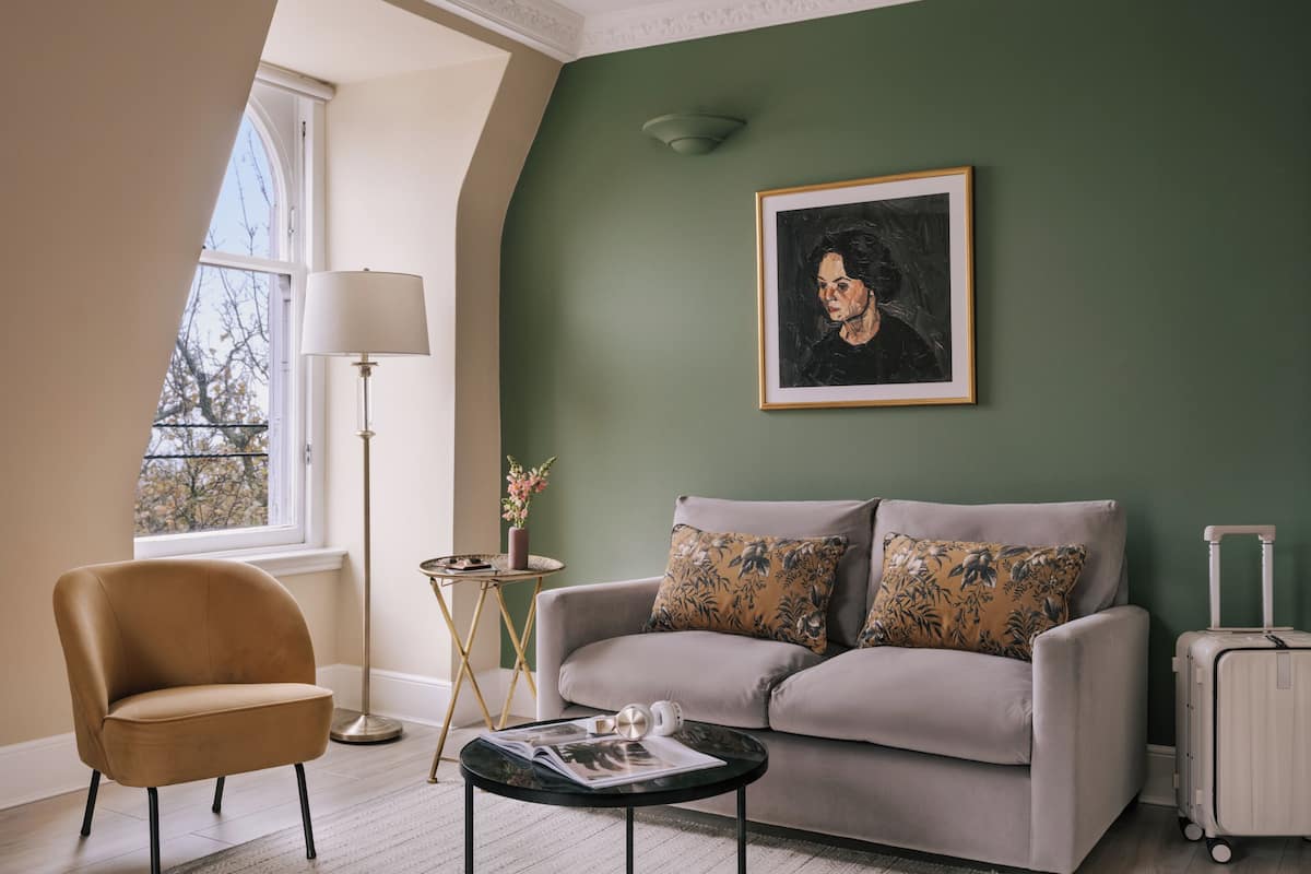 One Bedroom Suite - Queen Street View | Living area | 42-inch flat-screen TV with cable channels, TV