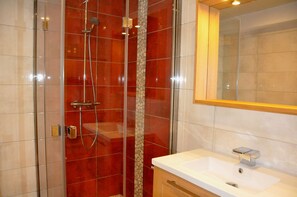 Shower, towels, soap, toilet paper