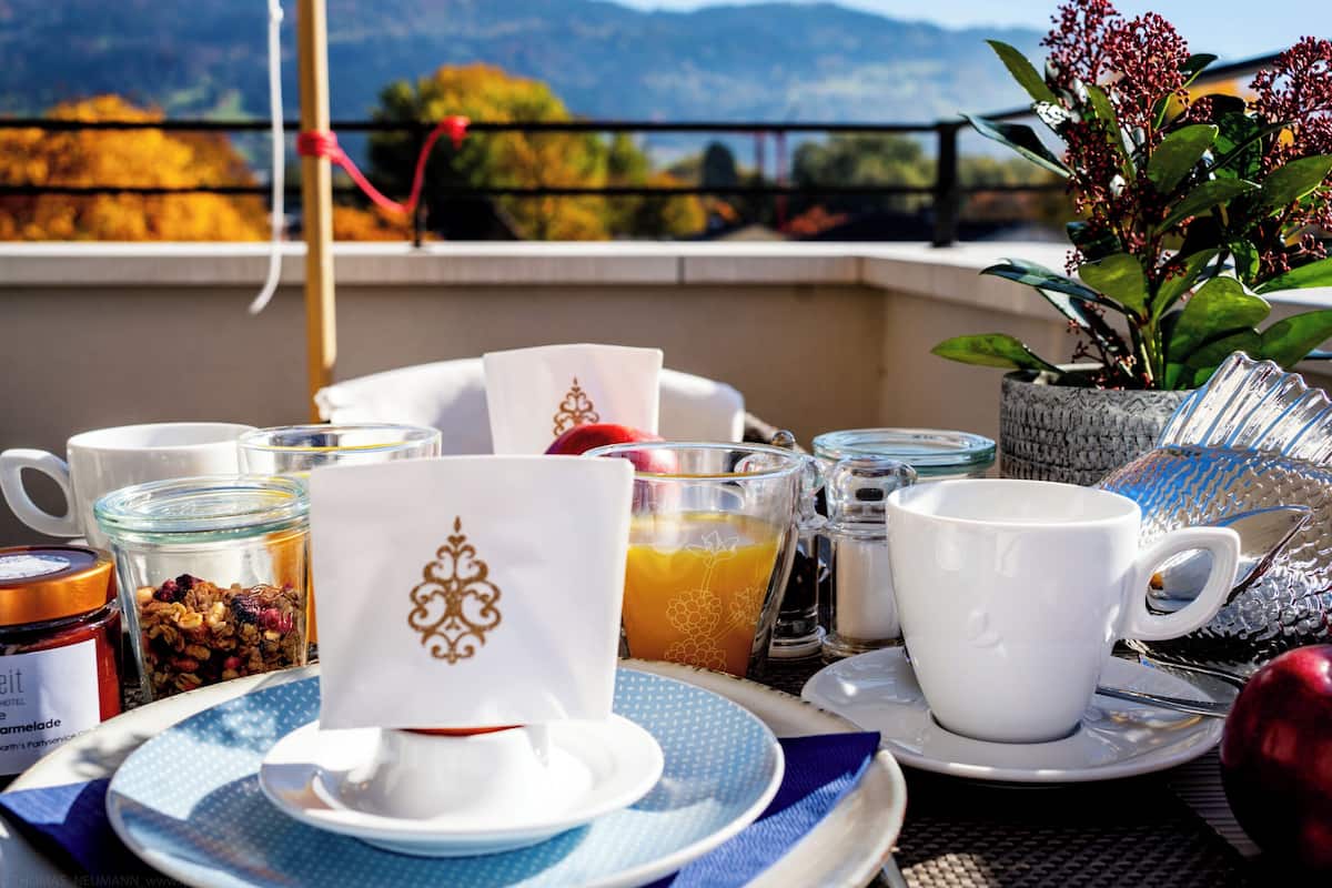 A breakfast setup with a view of mountains.