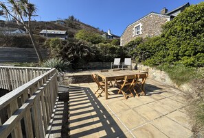 Outdoor dining - This lovely property sits above the beautiful sandy beach at Trevaunance Cove. (St Agnes)