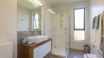 Superior Studio | Bathroom | Shower, hair dryer, towels, soap
