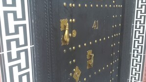 A black door with gold studs and a brass knocker, featuring a number '41' and a decorative plate. - Typical Riad at motivating price (Marrakech)