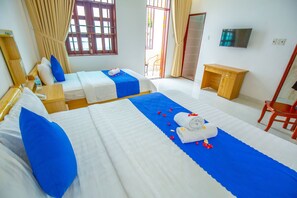 Deluxe Triple Room, City View | Minibar, in-room safe, desk, laptop workspace - TiMee Hotel & Apartment (Nha Trang)