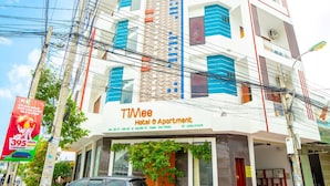A multi-story building with a sign for "TiMee Hotel & Apartment" on the ground floor. - TiMee Hotel & Apartment (Nam Nha Trang)