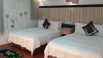 Deluxe Quadruple Room | 1 bedroom, down comforters, individually decorated