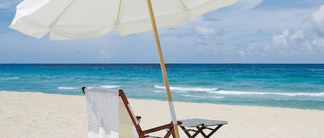 On the beach, sun loungers, beach towels