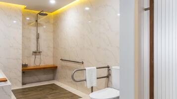 Deluxe Family Room | Bathroom | Free toiletries, hair dryer, bathrobes, slippers