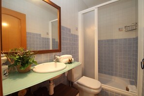 Shower, hair dryer, towels, toilet paper