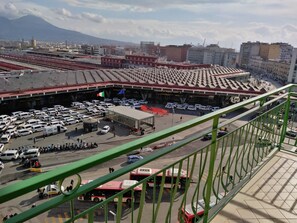 A train station with multiple tracks and a large parking area. - Delia Rooms & Gallery (Naples)
