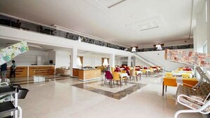 A spacious lobby with a central seating area, a staircase, and a sign reading "GARDEN HOUSE." - Green Garden House Hotel&Spa (Tefenni)