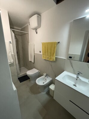 Hair dryer, towels, soap, shampoo