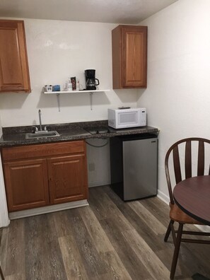 Fridge, microwave, stovetop, coffee/tea maker