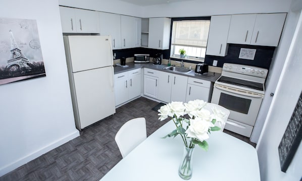 Fridge, microwave, stovetop, coffee/tea maker