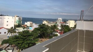 A cityscape with buildings, a beach, and a clear sky. - Sleepbox Hostel Phu Quoc (Phu Quoc)