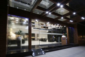 A modern hotel lobby with a glass facade, a reception desk, and a sign reading "KALASH." - Hotel Grand Kailash (Chhatrapati Sambhajinagar)