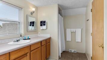 Bathtub, hair dryer, towels